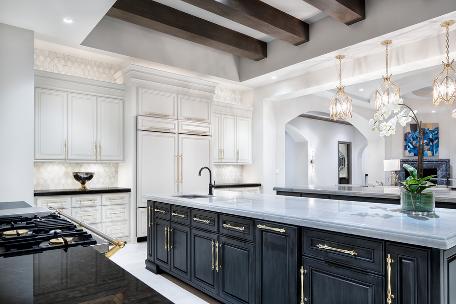 A kitchen space illuminated by Lutron lighting fixtures.